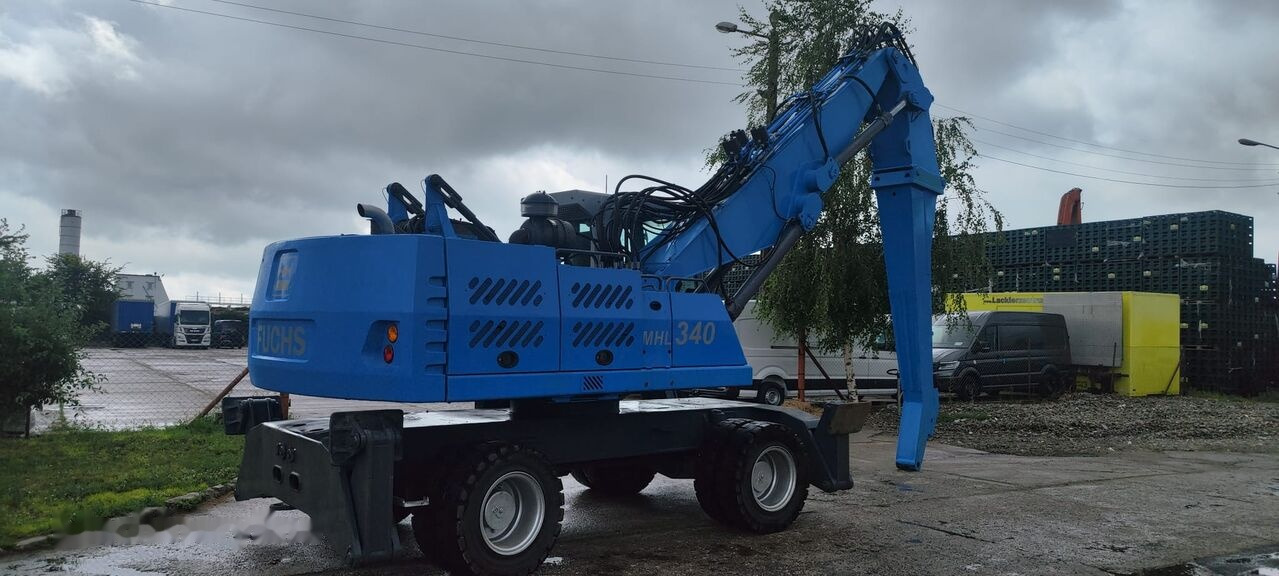 Atkritumu iekrāvējs Fuchs MHL 340 D FQC magnet generator: foto 7
