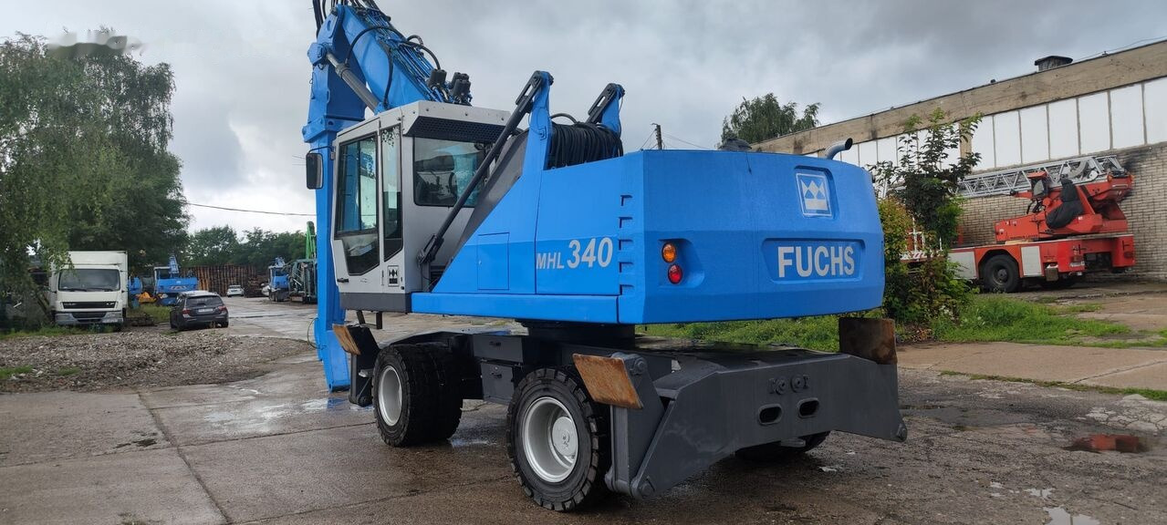 Atkritumu iekrāvējs Fuchs MHL 340 D FQC magnet generator: foto 9