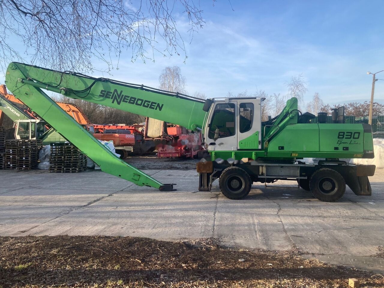 Sennebogen 830 M - Atkritumu iekrāvējs: foto 1 Sennebogen 830 M - Atkritumu iekrāvējs: foto 1