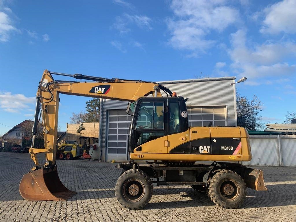 CAT M 316 D - Riteņu ekskavators: foto 2 CAT M 316 D - Riteņu ekskavators: foto 2