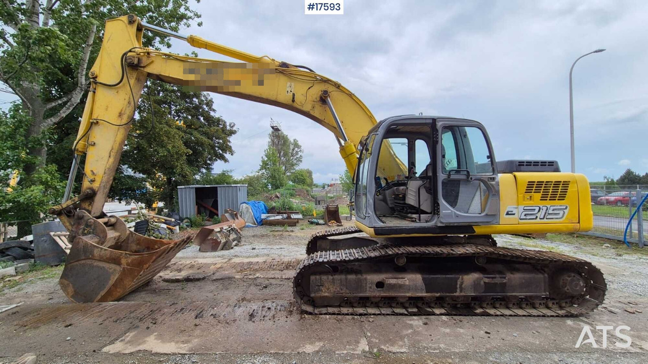 2005 New Holland E215 - Kāpurķēžu ekskavators: foto 1 2005 New Holland E215 - Kāpurķēžu ekskavators: foto 1