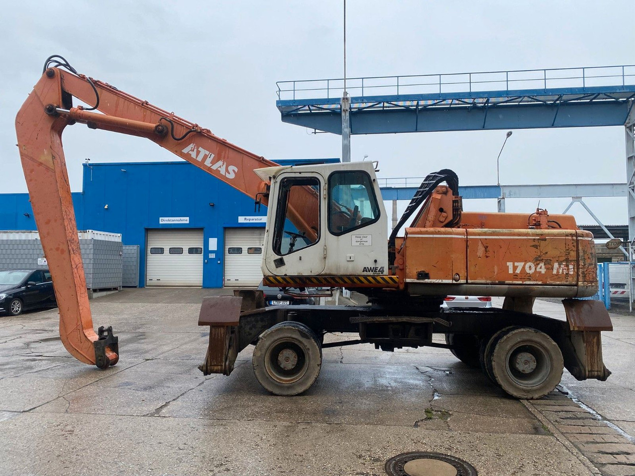 Atlas 1704 MI mit Greifer Umschlagbagger Lang - Riteņu ekskavators: foto 1 Atlas 1704 MI mit Greifer Umschlagbagger Lang - Riteņu ekskavators: foto 1