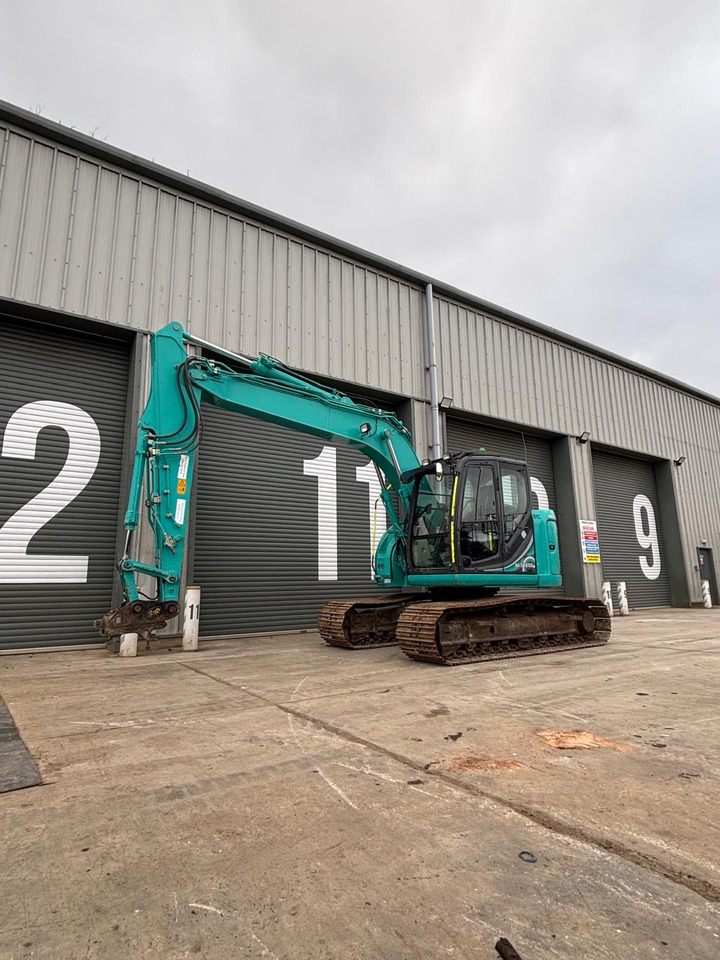 Kobelco SK140SRLC-5 - Kāpurķēžu ekskavators: foto 1 Kobelco SK140SRLC-5 - Kāpurķēžu ekskavators: foto 1