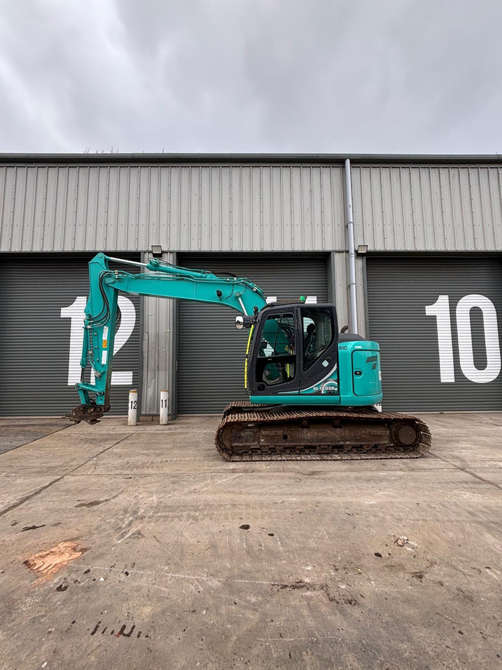 Kobelco SK140SRLC-5 - Kāpurķēžu ekskavators: foto 2 Kobelco SK140SRLC-5 - Kāpurķēžu ekskavators: foto 2