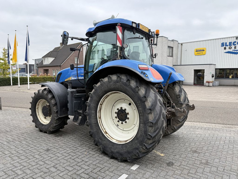 New Holland T7050 Power Command - Traktors: foto 2 New Holland T7050 Power Command - Traktors: foto 2