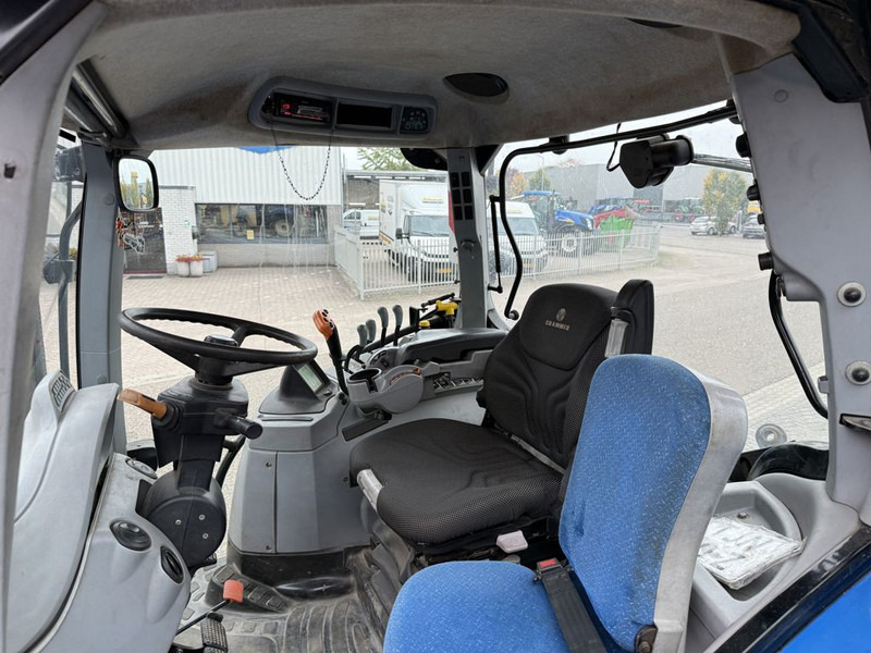 New Holland T7050 Power Command - Traktors: foto 5 New Holland T7050 Power Command - Traktors: foto 5