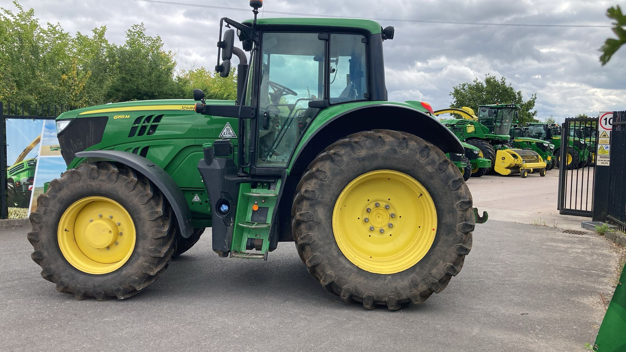 John Deer 6155M - Traktors: foto 1 John Deer 6155M - Traktors: foto 1
