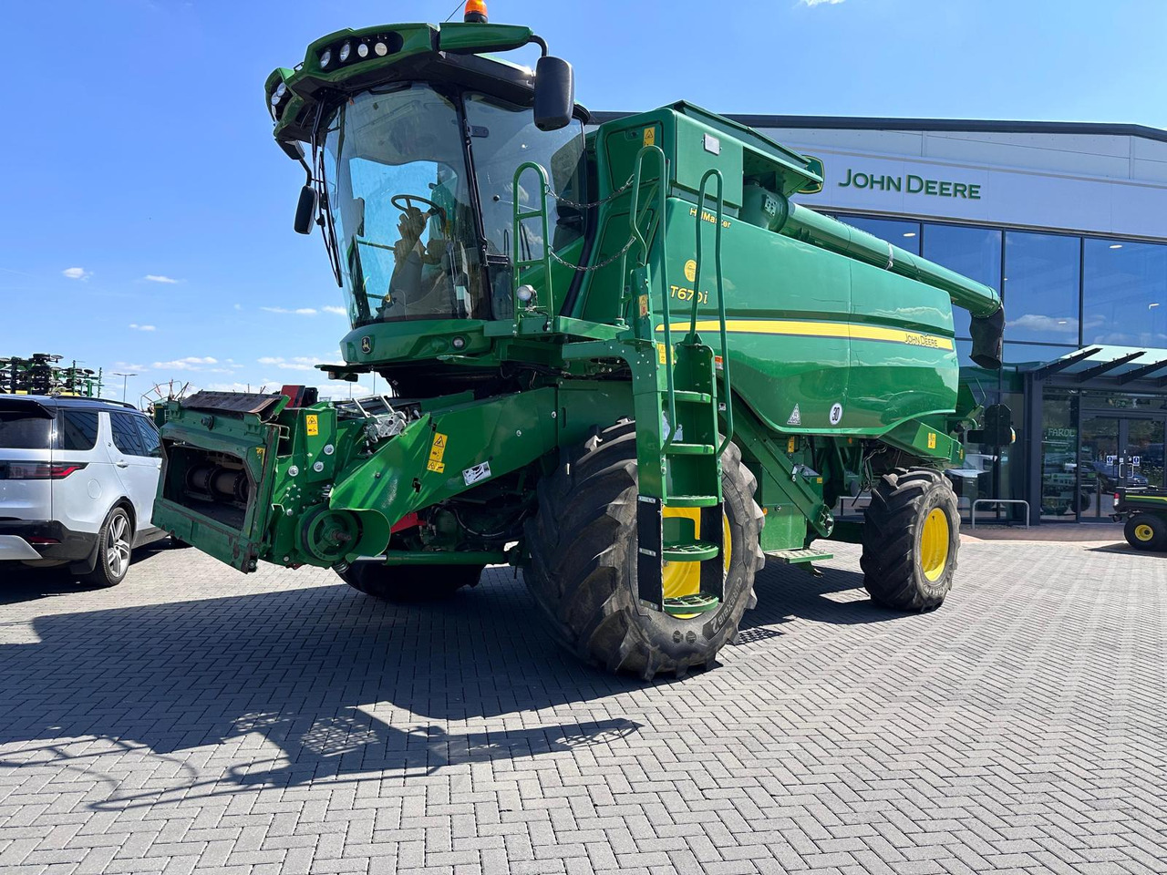 John Deere T670i HM - Labības kombains: foto 1 John Deere T670i HM - Labības kombains: foto 1