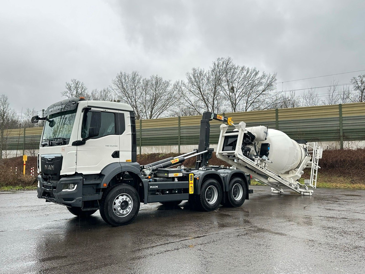 MAN TGS 33.440 6x4 Euro6e Abroller + Fahrmischer - Pacēlājs ar āķi, Kravas auto ar manipulatoru: foto 1 MAN TGS 33.440 6x4 Euro6e Abroller + Fahrmischer - Pacēlājs ar āķi, Kravas auto ar manipulatoru: foto 1