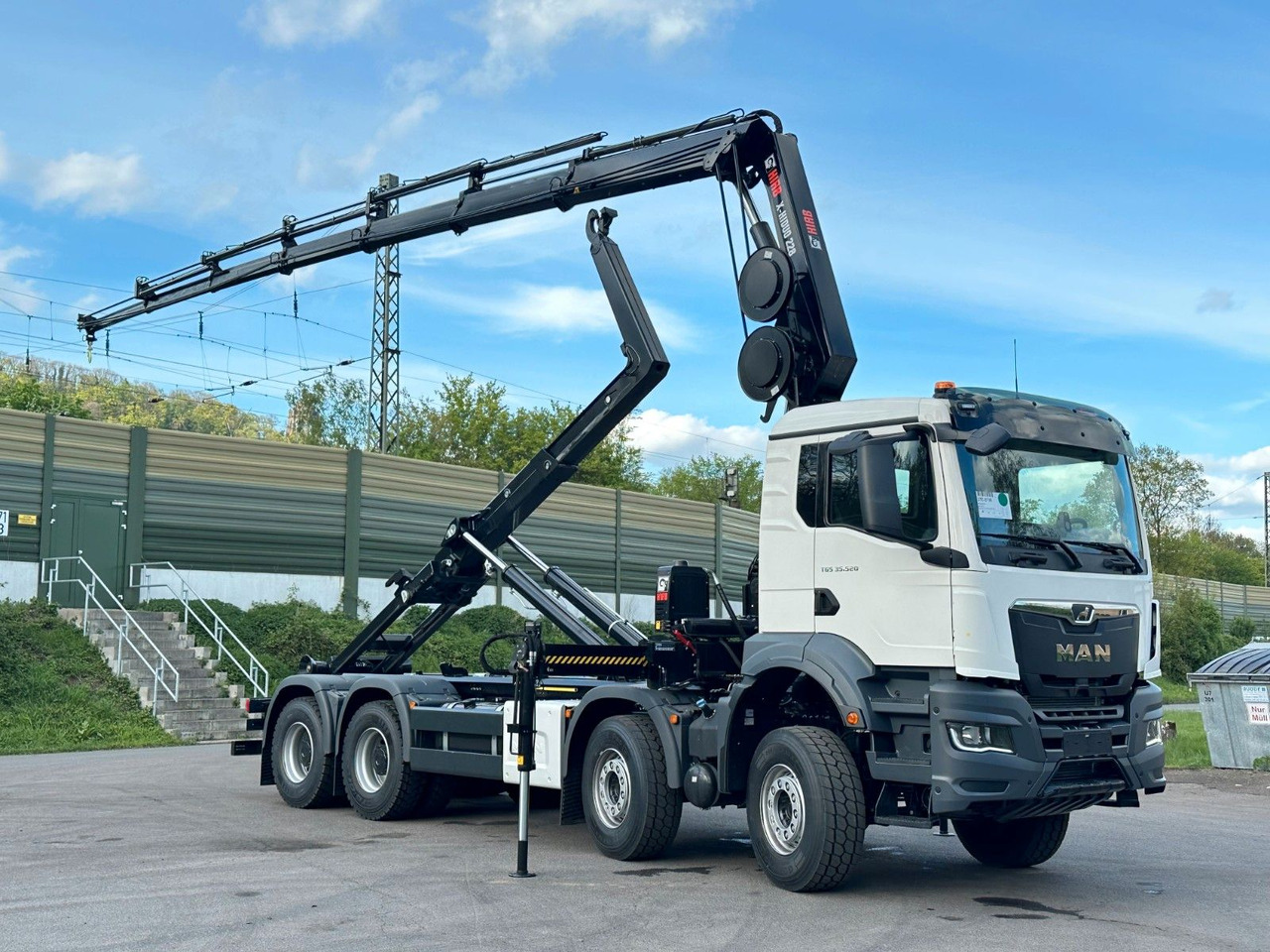 MAN TGS 35.520 8x4 Abrollkipper + Kran HIAB 228-6 - Pacēlājs ar āķi, Kravas auto ar manipulatoru: foto 1 MAN TGS 35.520 8x4 Abrollkipper + Kran HIAB 228-6 - Pacēlājs ar āķi, Kravas auto ar manipulatoru: foto 1