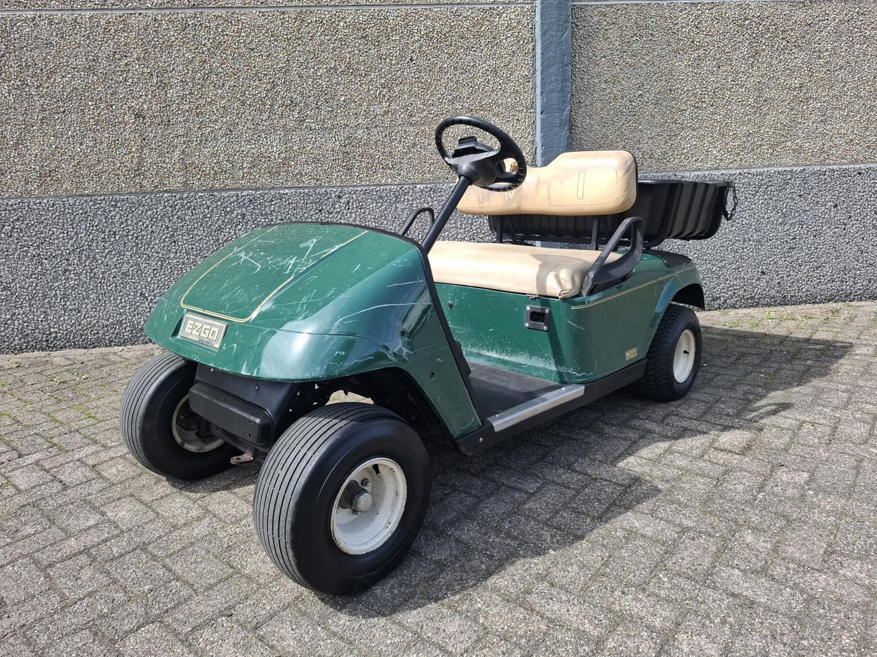 E-Z-GO TXT 2-Persoons Elektrische Golfkar met Open Laadbak - Golfa mašīna: foto 1 E-Z-GO TXT 2-Persoons Elektrische Golfkar met Open Laadbak - Golfa mašīna: foto 1