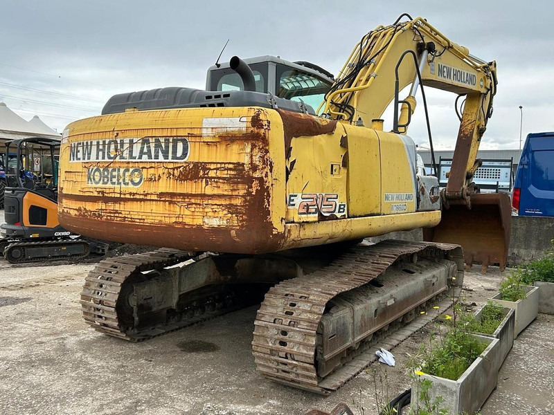 New Holland E215B - Ekskavators: foto 5 New Holland E215B - Ekskavators: foto 5