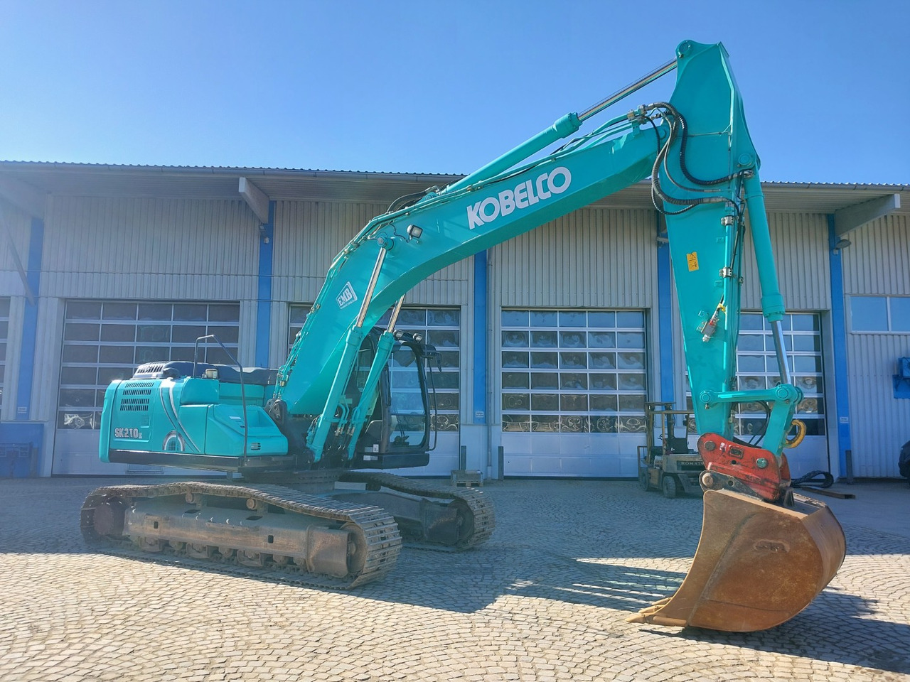 Kobelco SK210LC-10 - Kāpurķēžu ekskavators: foto 4 Kobelco SK210LC-10 - Kāpurķēžu ekskavators: foto 4