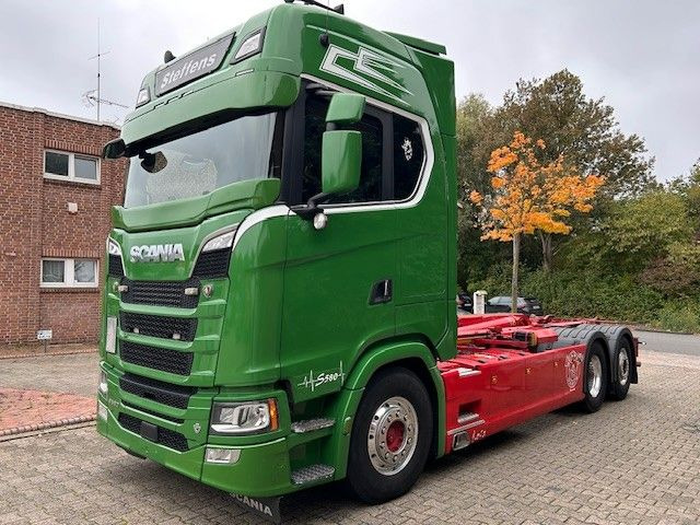 Scania S580 V8 MEILLER Abroller mit Lift+Lenkachse 6x2 - Pacēlājs ar āķi: foto 1 Scania S580 V8 MEILLER Abroller mit Lift+Lenkachse 6x2 - Pacēlājs ar āķi: foto 1