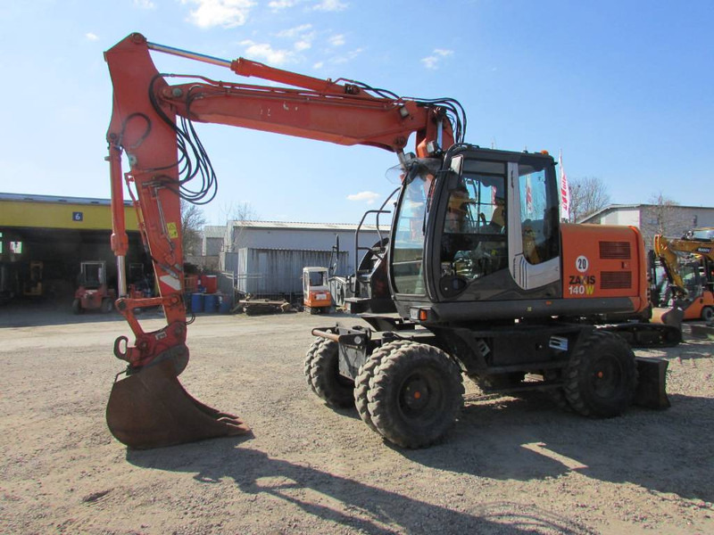 Hitachi ZX 140 W-3 Mobilbagger 43.000 EUR / Klima - Riteņu ekskavators: foto 1 Hitachi ZX 140 W-3 Mobilbagger 43.000 EUR / Klima - Riteņu ekskavators: foto 1
