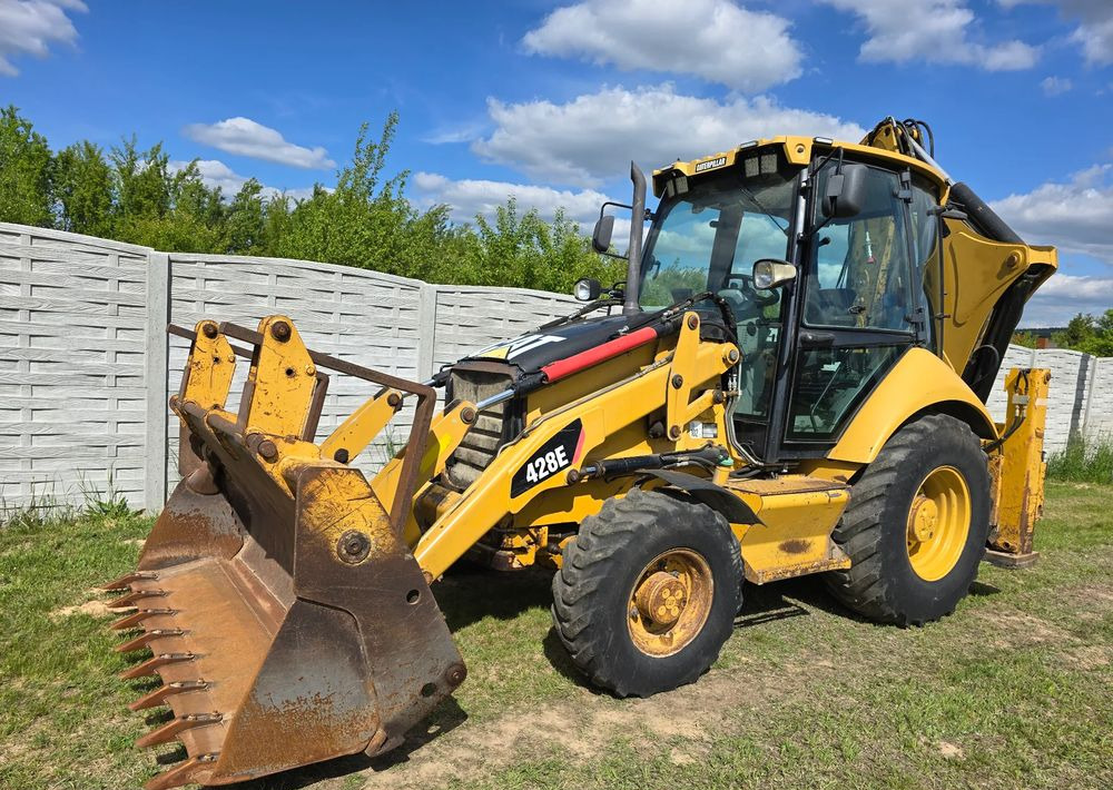 Caterpillar - Ekskavators-iekrāvējs: foto 1 Caterpillar - Ekskavators-iekrāvējs: foto 1