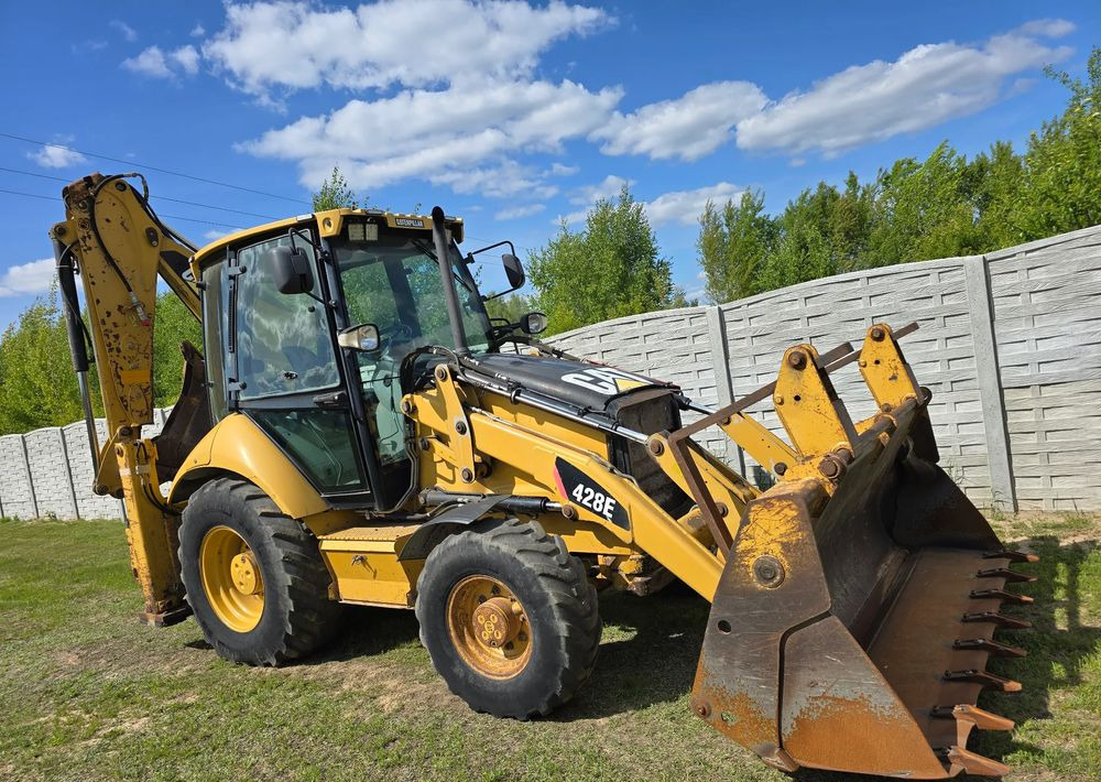 Caterpillar - Ekskavators-iekrāvējs: foto 1 Caterpillar - Ekskavators-iekrāvējs: foto 1