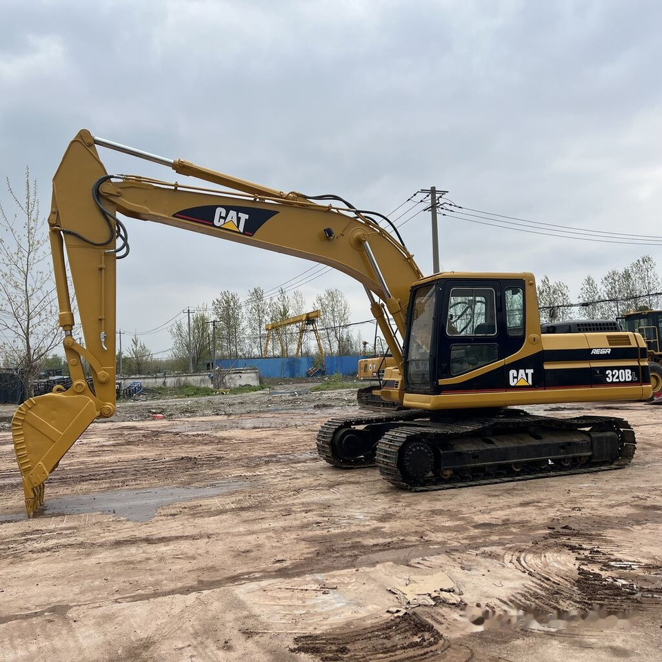 Caterpillar 320BL - Kāpurķēžu ekskavators: foto 1 Caterpillar 320BL - Kāpurķēžu ekskavators: foto 1