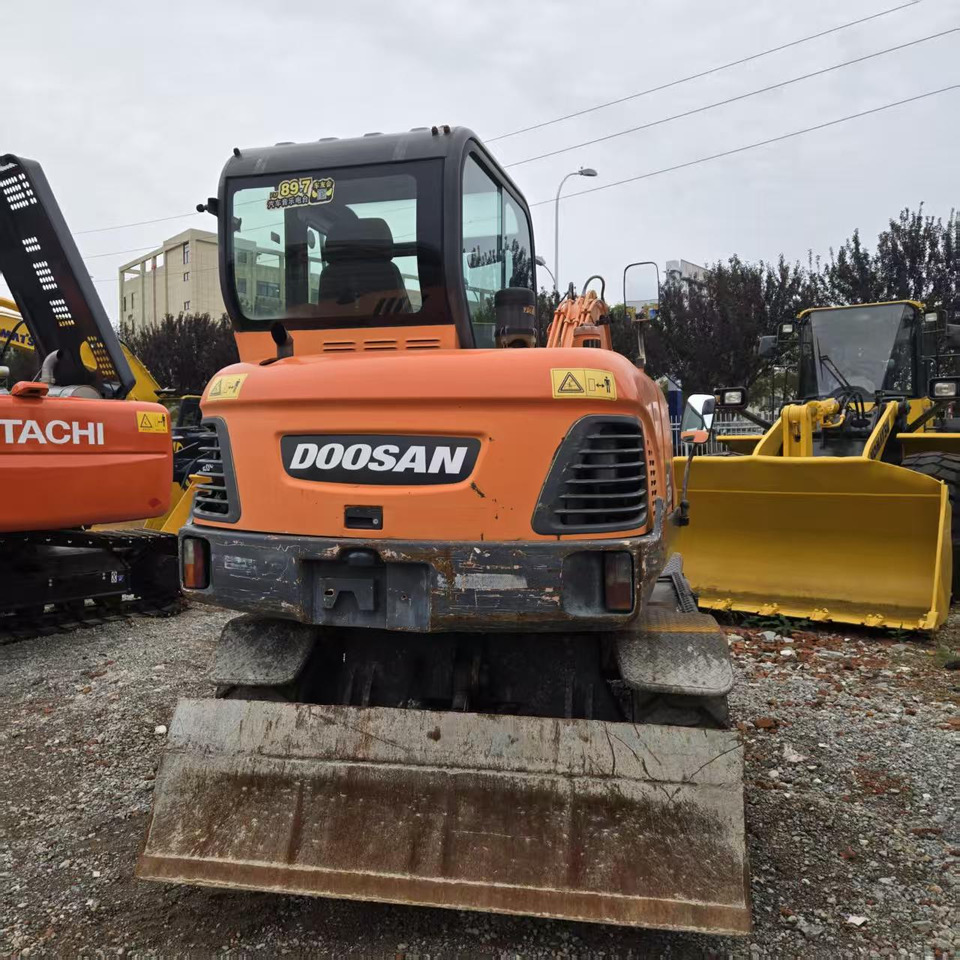 DOOSAN DX60W - Riteņu ekskavators: foto 4 DOOSAN DX60W - Riteņu ekskavators: foto 4