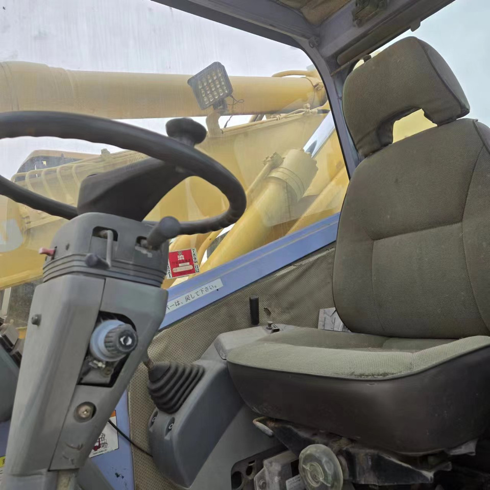KOMATSU PC128US - Riteņu ekskavators: foto 5 KOMATSU PC128US - Riteņu ekskavators: foto 5