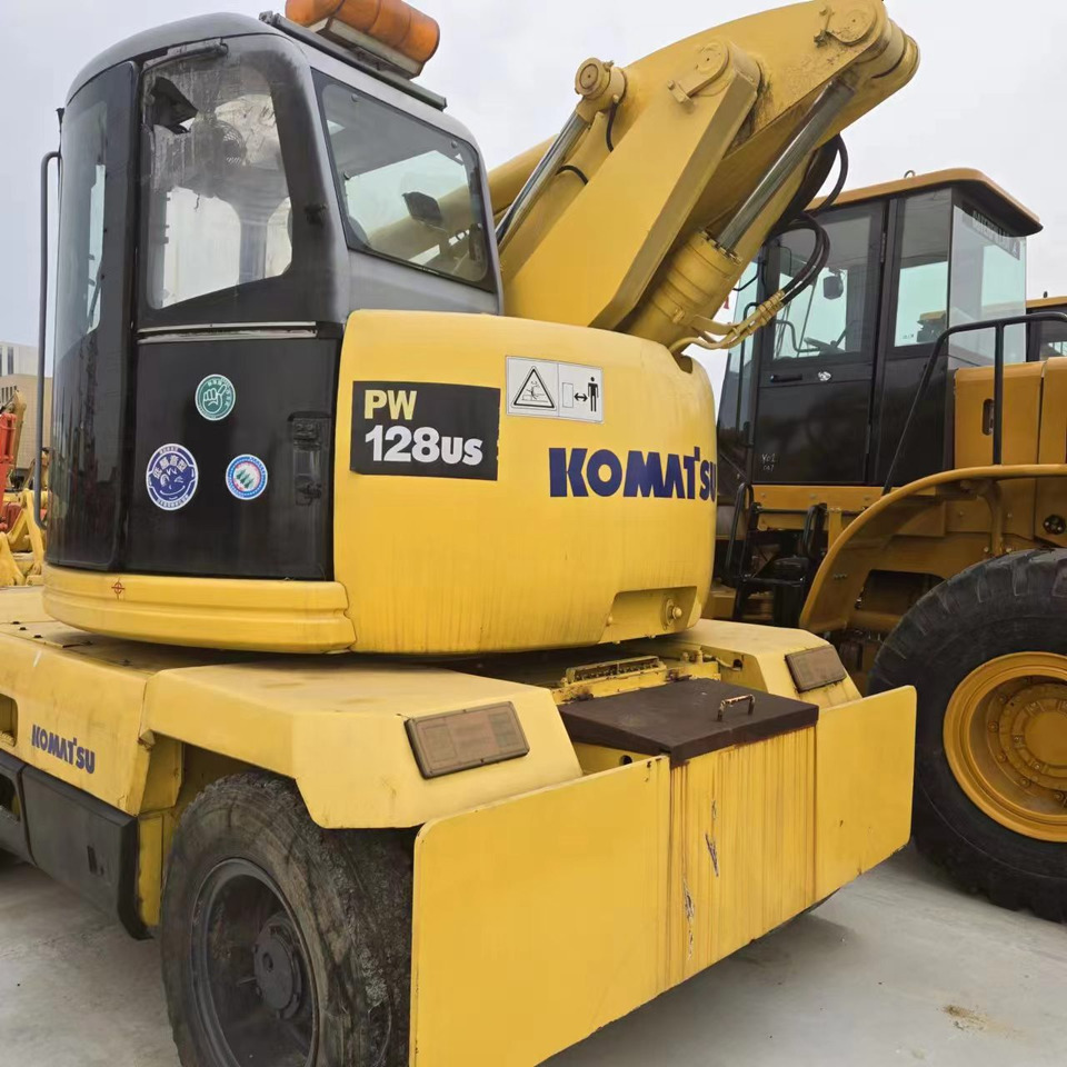 KOMATSU PC128US - Riteņu ekskavators: foto 4 KOMATSU PC128US - Riteņu ekskavators: foto 4