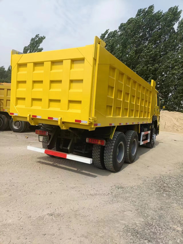 SINOTRUK HOWO - Kravas automašīna pašizgāzējs: foto 3 SINOTRUK HOWO - Kravas automašīna pašizgāzējs: foto 3