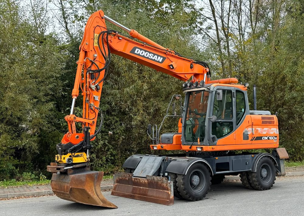 Doosan * DOOSAN DX160W *ROTOTILT* GPS 2D Leica * Sprowadzona * Stan Perfekcyjny * Koparka Kołowa * - Riteņu ekskavators: foto 1 Doosan * DOOSAN DX160W *ROTOTILT* GPS 2D Leica * Sprowadzona * Stan Perfekcyjny * Koparka Kołowa * - Riteņu ekskavators: foto 1