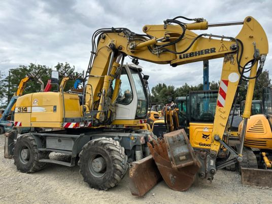 Liebherr A314 LITRONIC - Riteņu ekskavators: foto 1 Liebherr A314 LITRONIC - Riteņu ekskavators: foto 1