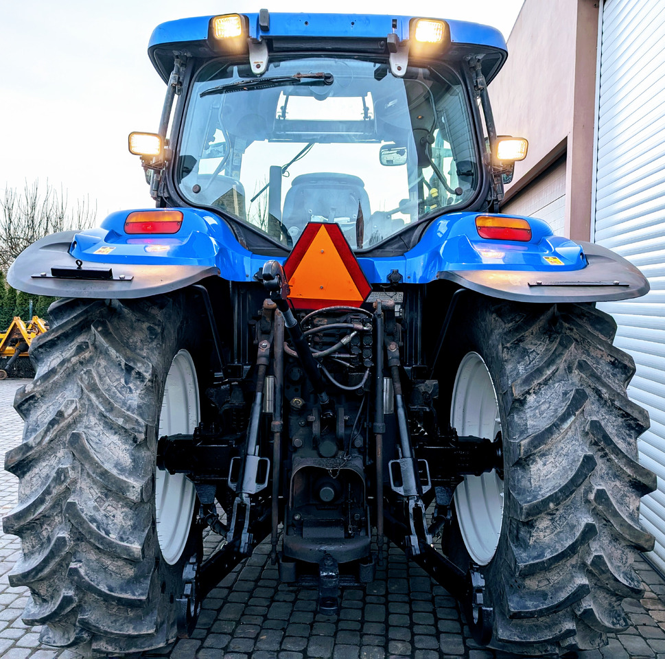 New Holland TS115A - Traktors: foto 2 New Holland TS115A - Traktors: foto 2