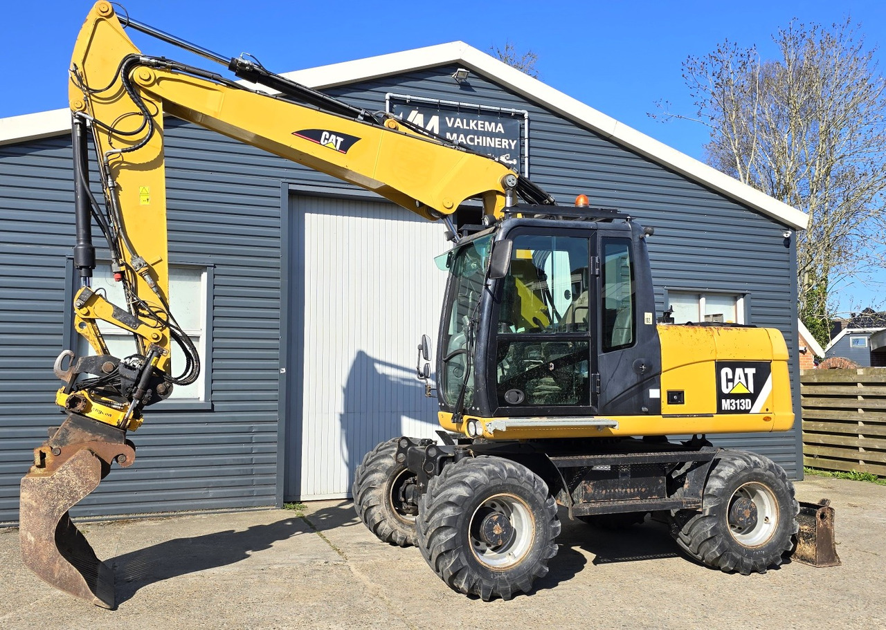 CATERPILLAR M313D - Riteņu ekskavators: foto 1 CATERPILLAR M313D - Riteņu ekskavators: foto 1