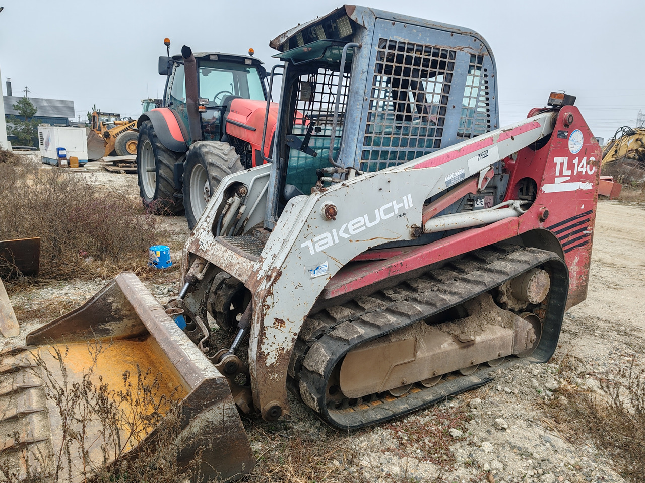 Takeuchi TL140 - Kāpurķēžu kompaktiekrāvējs: foto 1 Takeuchi TL140 - Kāpurķēžu kompaktiekrāvējs: foto 1