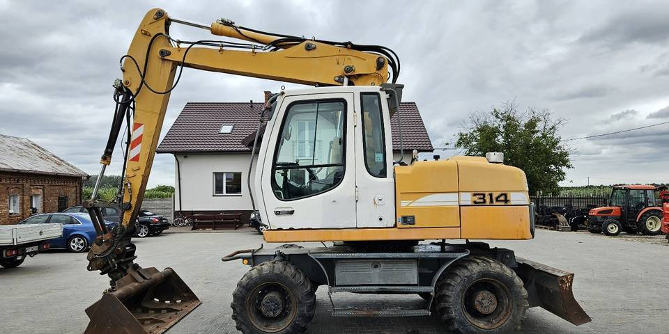 Koparka kołowa Liebherr A314 Litronic 9350 h 4 łyżki kołówka - Riteņu ekskavators: foto 1 Koparka kołowa Liebherr A314 Litronic 9350 h 4 łyżki kołówka - Riteņu ekskavators: foto 1