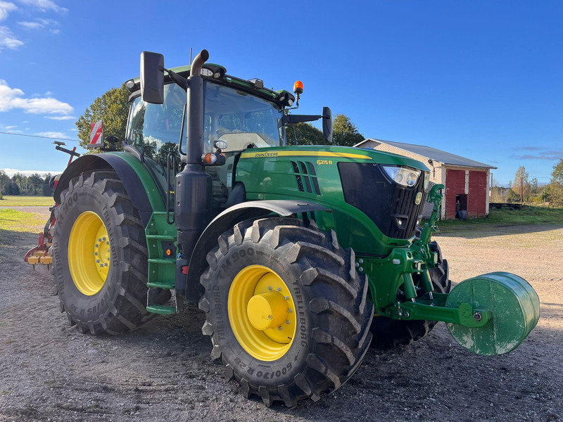 John Deere 6215R Autopowr - Traktors: foto 1 John Deere 6215R Autopowr - Traktors: foto 1