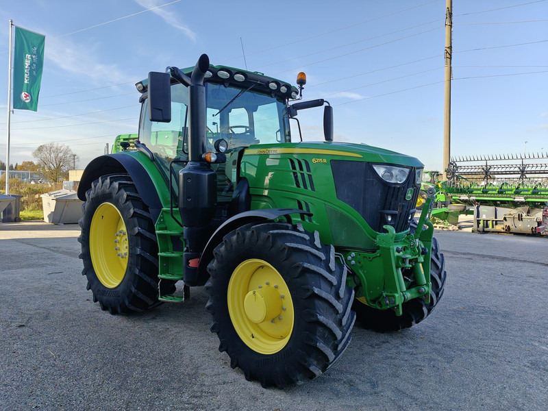 John Deere 6215R Autopowr - Traktors: foto 1 John Deere 6215R Autopowr - Traktors: foto 1