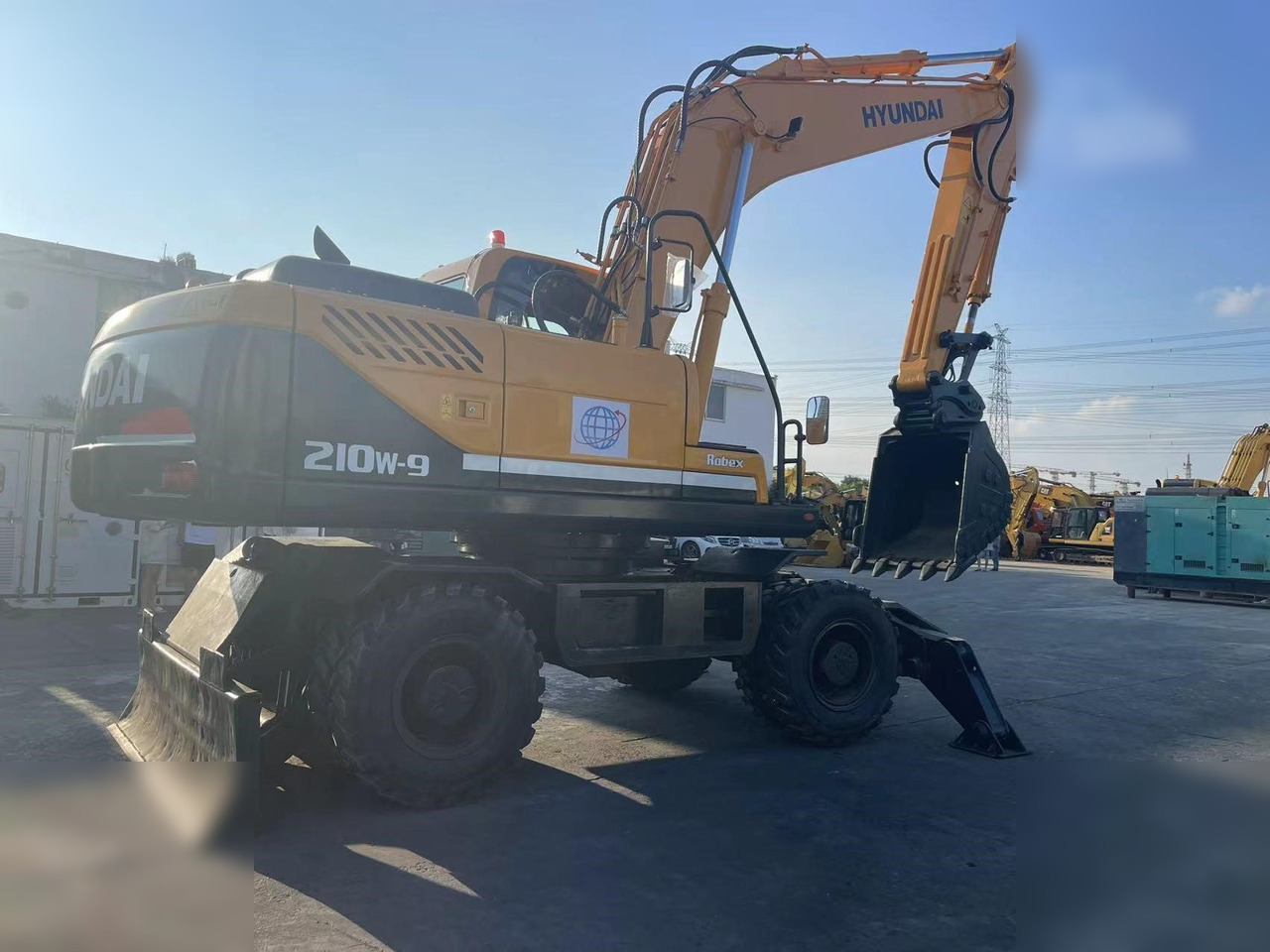HYUNDAI ROBEX 210W-9 - Riteņu ekskavators: foto 2 HYUNDAI ROBEX 210W-9 - Riteņu ekskavators: foto 2