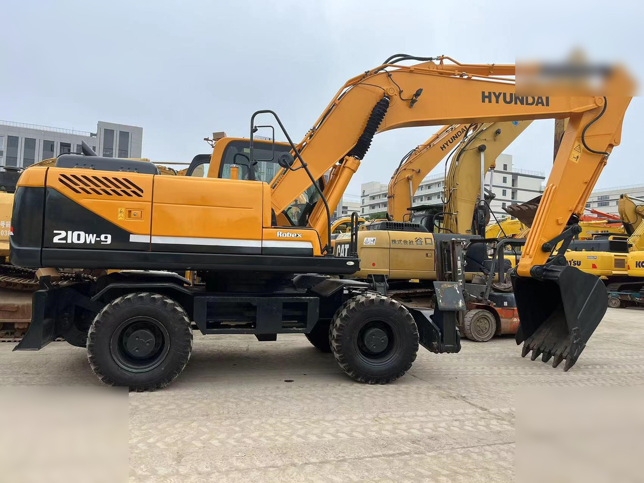 HYUNDAI ROBEX 210W-9 - Riteņu ekskavators: foto 1 HYUNDAI ROBEX 210W-9 - Riteņu ekskavators: foto 1