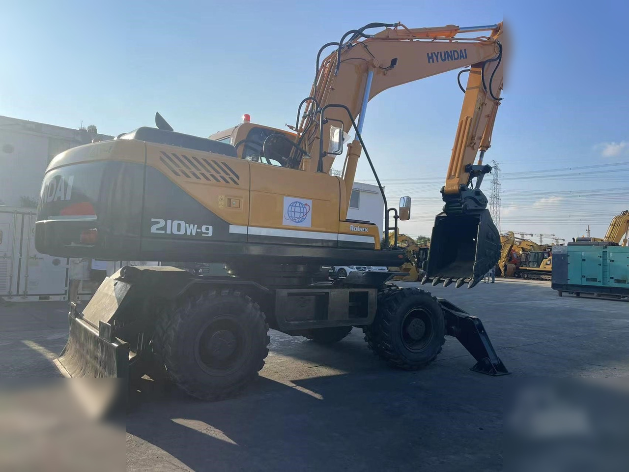 HYUNDAI ROBEX 210W-9 - Riteņu ekskavators: foto 2 HYUNDAI ROBEX 210W-9 - Riteņu ekskavators: foto 2