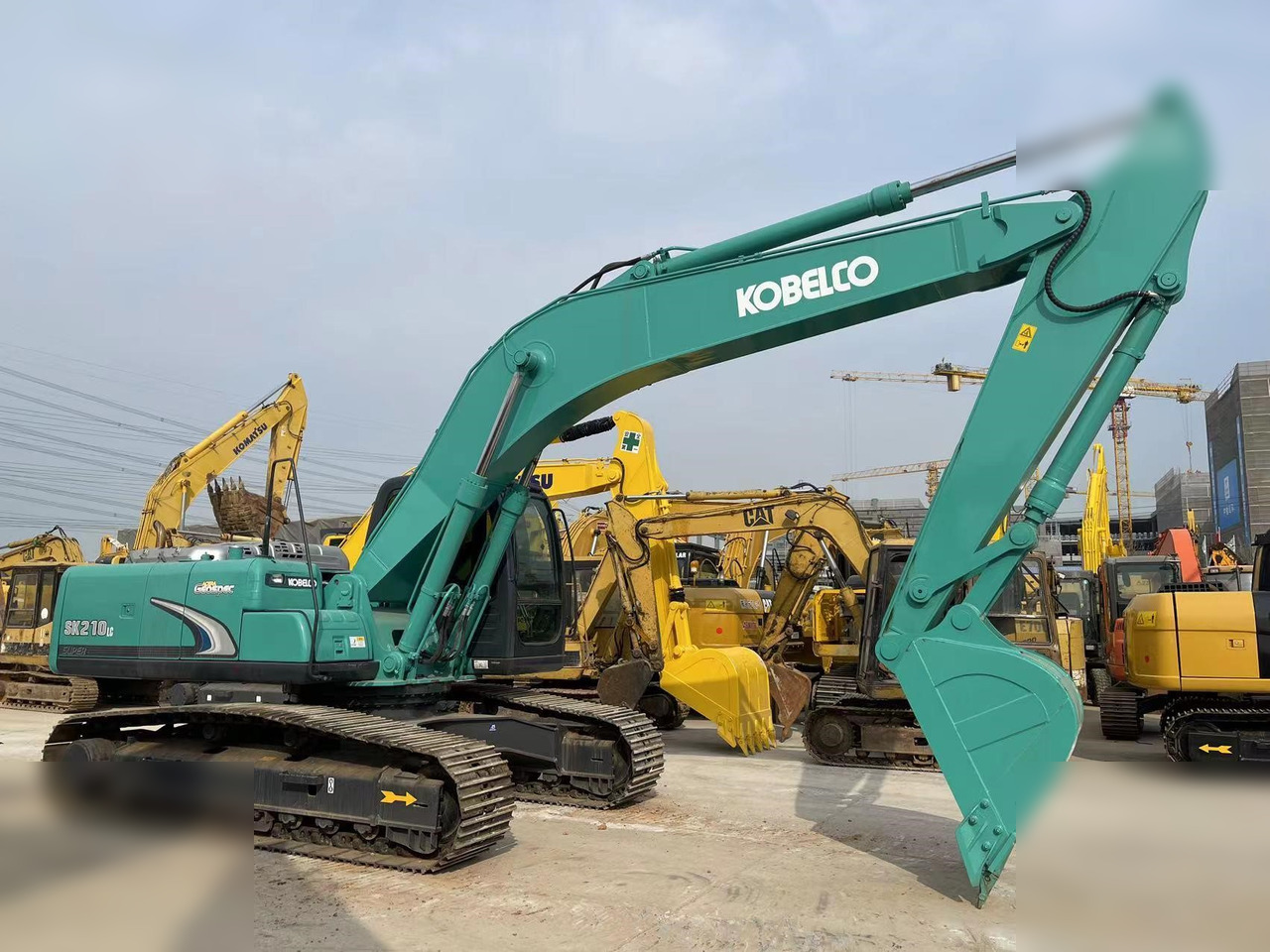 KOBELCO SK210 - Kāpurķēžu ekskavators: foto 1 KOBELCO SK210 - Kāpurķēžu ekskavators: foto 1