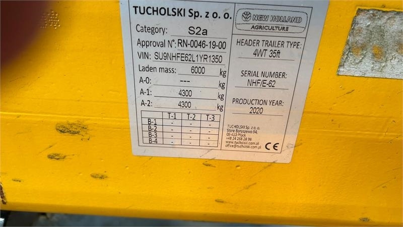 New Holland 4 hjulet skærebordsvogn - Lauksaimniecības piekabe: foto 3 New Holland 4 hjulet skærebordsvogn - Lauksaimniecības piekabe: foto 3