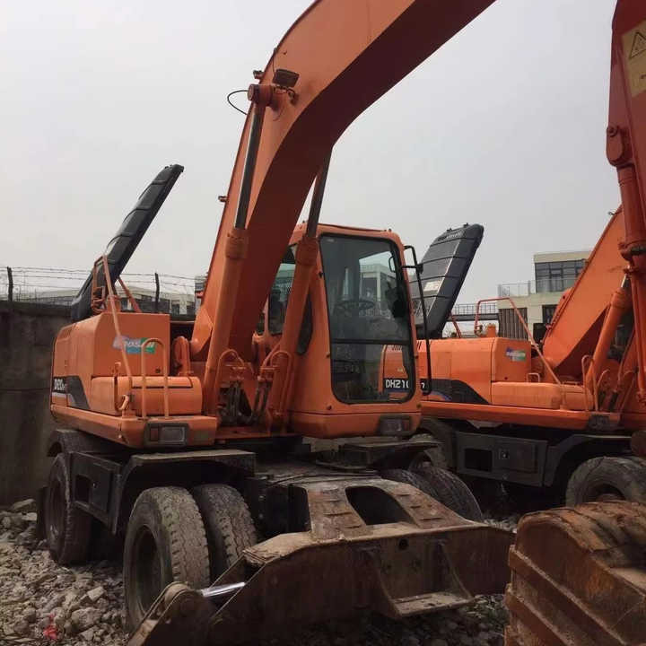 Used Digger Doosan Dh210w-7 Construction Machinery Construction Digger Used Doosan Dh210w-7 Cheap Excavator - Riteņu ekskavators: foto 1 Used Digger Doosan Dh210w-7 Construction Machinery Construction Digger Used Doosan Dh210w-7 Cheap Excavator - Riteņu ekskavators: foto 1