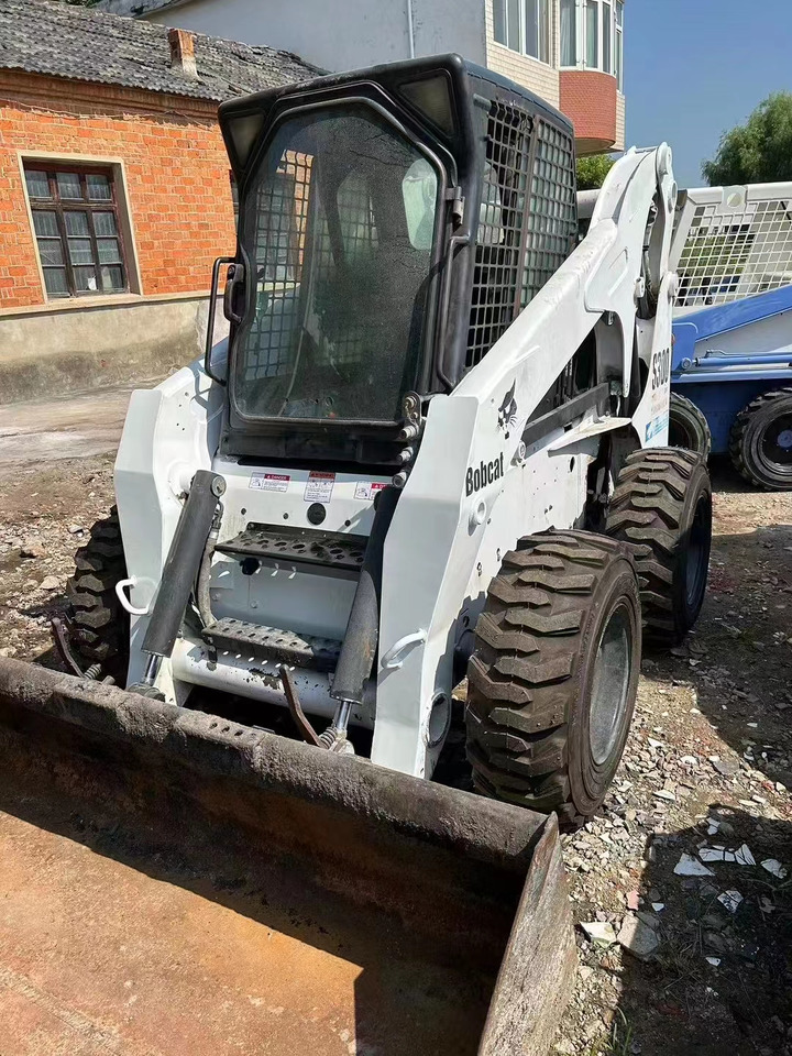 High Quality Mini Construction Machine Used Bobcat Skid Steer Loader S300 in Stock for Sale Bobcat Loader With Low Price - Kompaktiekrāvējs: foto 1 High Quality Mini Construction Machine Used Bobcat Skid Steer Loader S300 in Stock for Sale Bobcat Loader With Low Price - Kompaktiekrāvējs: foto 1
