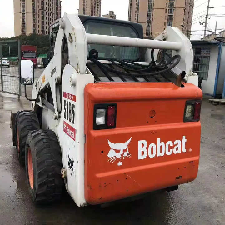 Used Bob Cat Bob Cat S185 Used Mini Skid Steer Wheel Loader Multifunctional Track Loaders Bobcat - Riteņu iekrāvējs: foto 1 Used Bob Cat Bob Cat S185 Used Mini Skid Steer Wheel Loader Multifunctional Track Loaders Bobcat - Riteņu iekrāvējs: foto 1