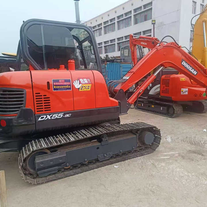 Used Digger DOOSAN DX55 Construction Machinery Construction Digger Used DOOSAN DX55 Cheap Excavator - Kāpurķēžu ekskavators: foto 1 Used Digger DOOSAN DX55 Construction Machinery Construction Digger Used DOOSAN DX55 Cheap Excavator - Kāpurķēžu ekskavators: foto 1