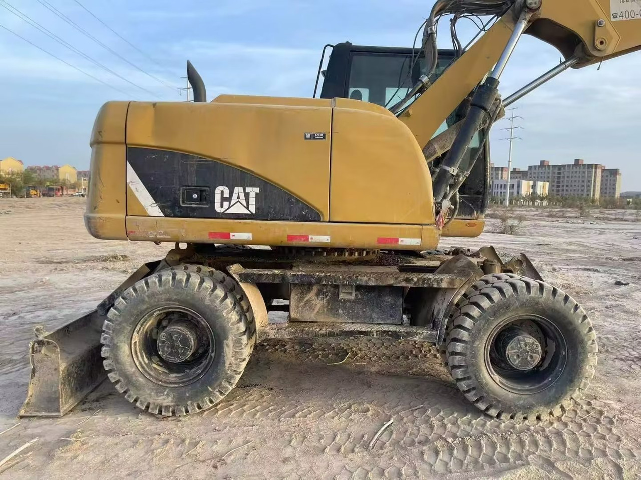 CATERPILLAR M315 - Riteņu ekskavators: foto 1 CATERPILLAR M315 - Riteņu ekskavators: foto 1