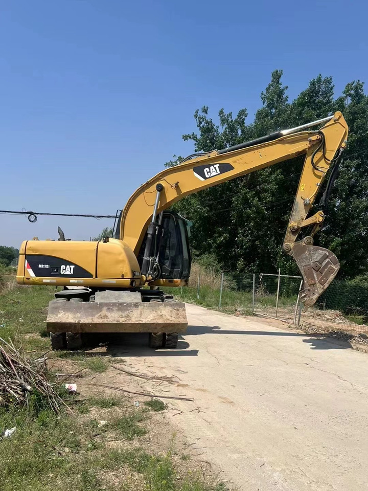 CATERPILLAR M317 - Riteņu ekskavators: foto 1 CATERPILLAR M317 - Riteņu ekskavators: foto 1
