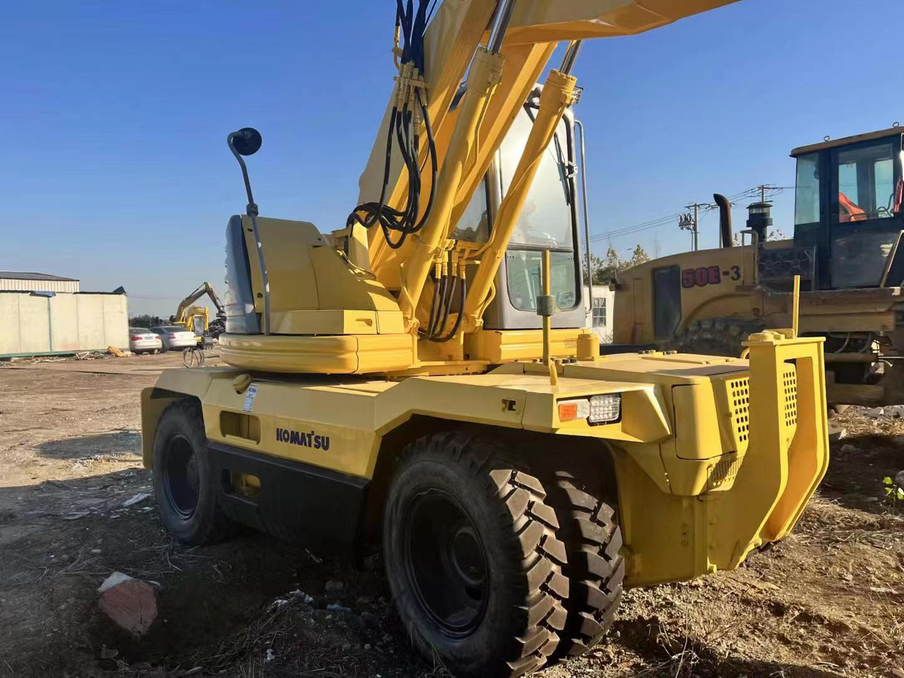 KOMATSU PC128US - Riteņu ekskavators: foto 3 KOMATSU PC128US - Riteņu ekskavators: foto 3