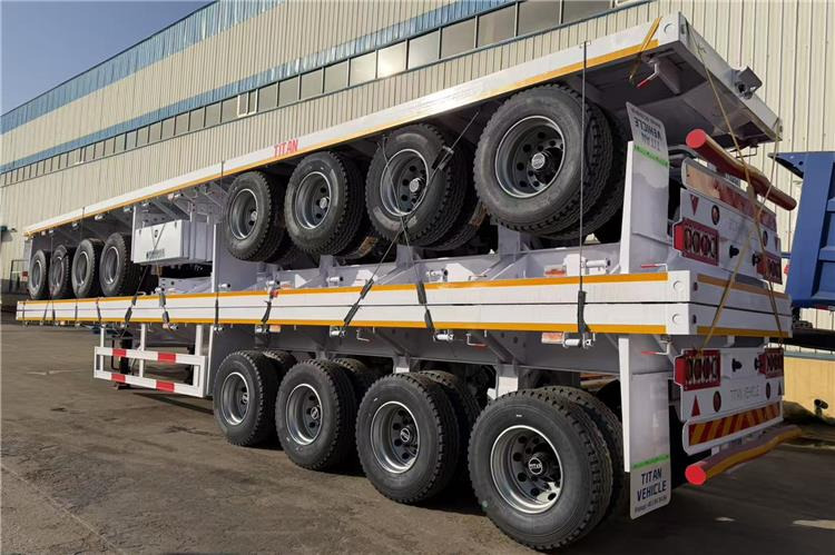 TITAN 4 Axle Flatbed Trailer for Sale In Saudi Arabia - Bortu puspiekabe/ Platforma: foto 2 TITAN 4 Axle Flatbed Trailer for Sale In Saudi Arabia - Bortu puspiekabe/ Platforma: foto 2