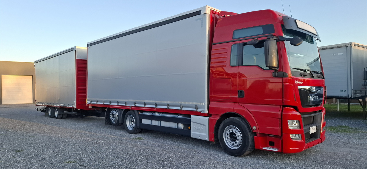 MAN TGX 26.440 E6 + SCHMITZ - Kravas automašīna ar tentu: foto 5 MAN TGX 26.440 E6 + SCHMITZ - Kravas automašīna ar tentu: foto 5
