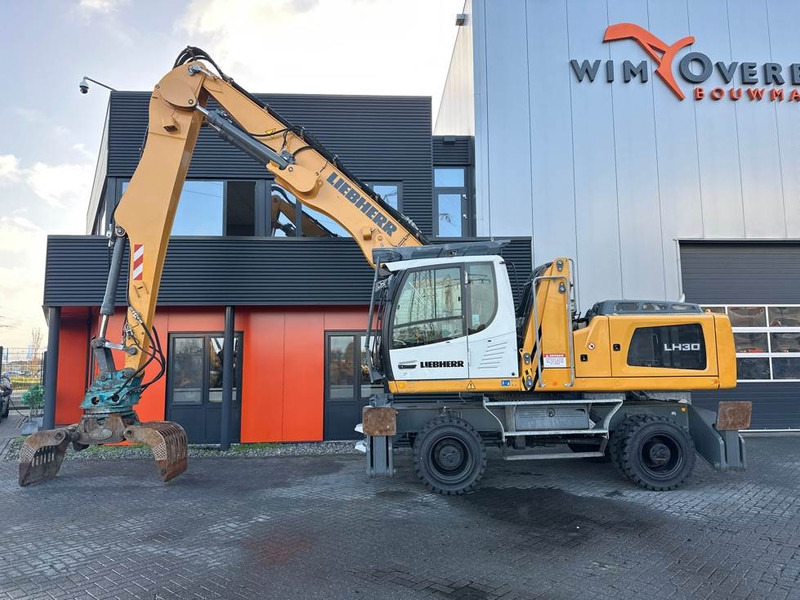 Liebherr LH 30 M - Atkritumu iekrāvējs: foto 1 Liebherr LH 30 M - Atkritumu iekrāvējs: foto 1