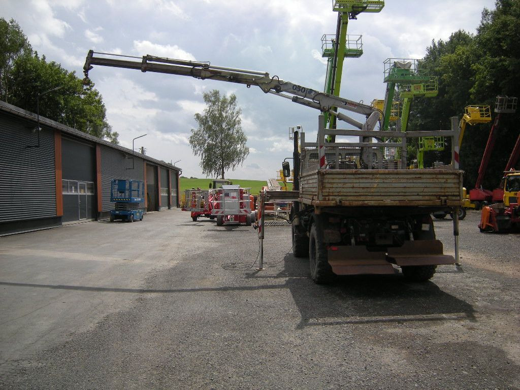 Mercedes-Benz Unimog U1250 mit Kran MKG 105 - Komercauto pašizgāzējs: foto 4 Mercedes-Benz Unimog U1250 mit Kran MKG 105 - Komercauto pašizgāzējs: foto 4